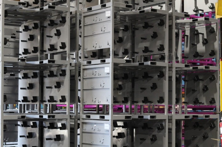 Stacked gray steel racks with built-in fixtures