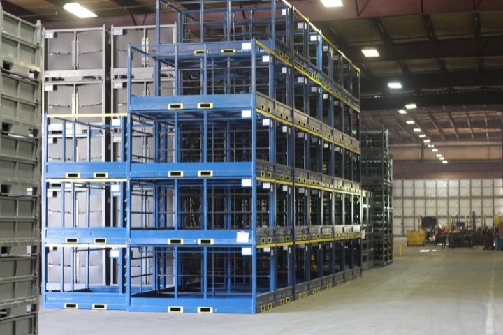 Stacked blue and gray steel racks in a warehouse