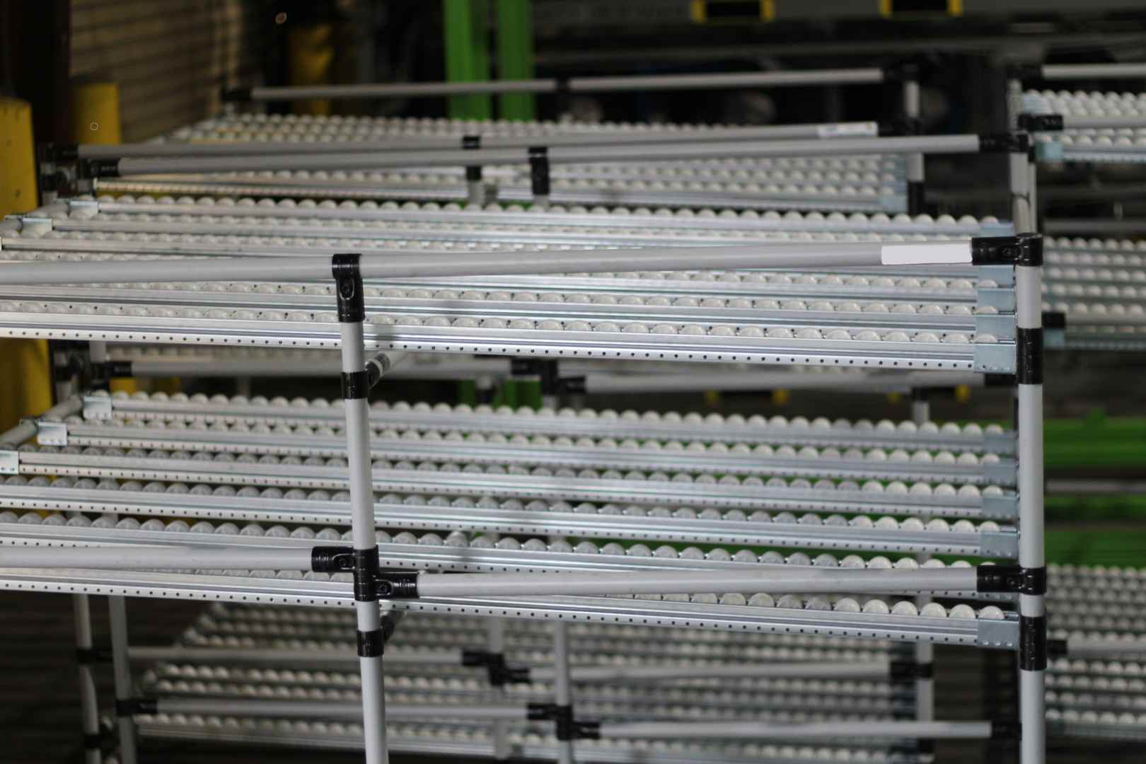 Close up of kanban flow rack with rollers