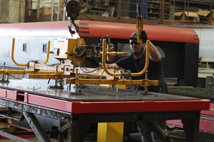 Custom sheet metal handling equipment supporting parts transport on the industrial shop floor.