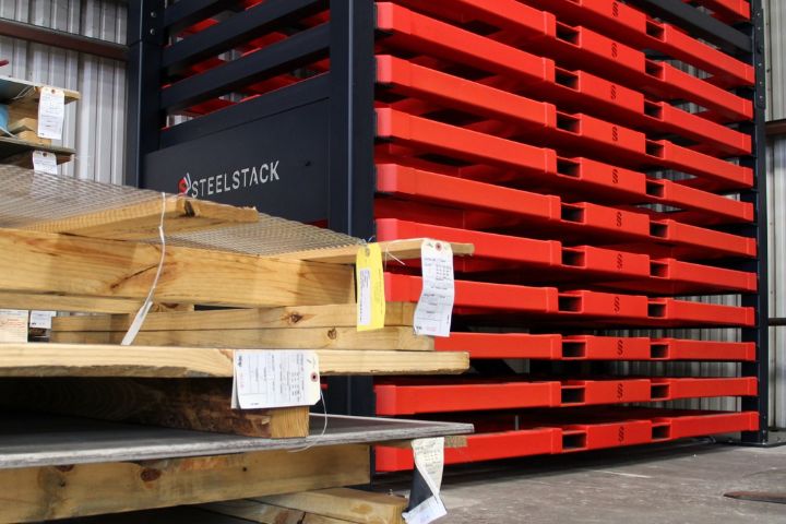 Custom red sheet metal storage racks.